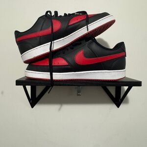 Red and black Nike Men’s Court Vision Low sneakers in excellent condition.